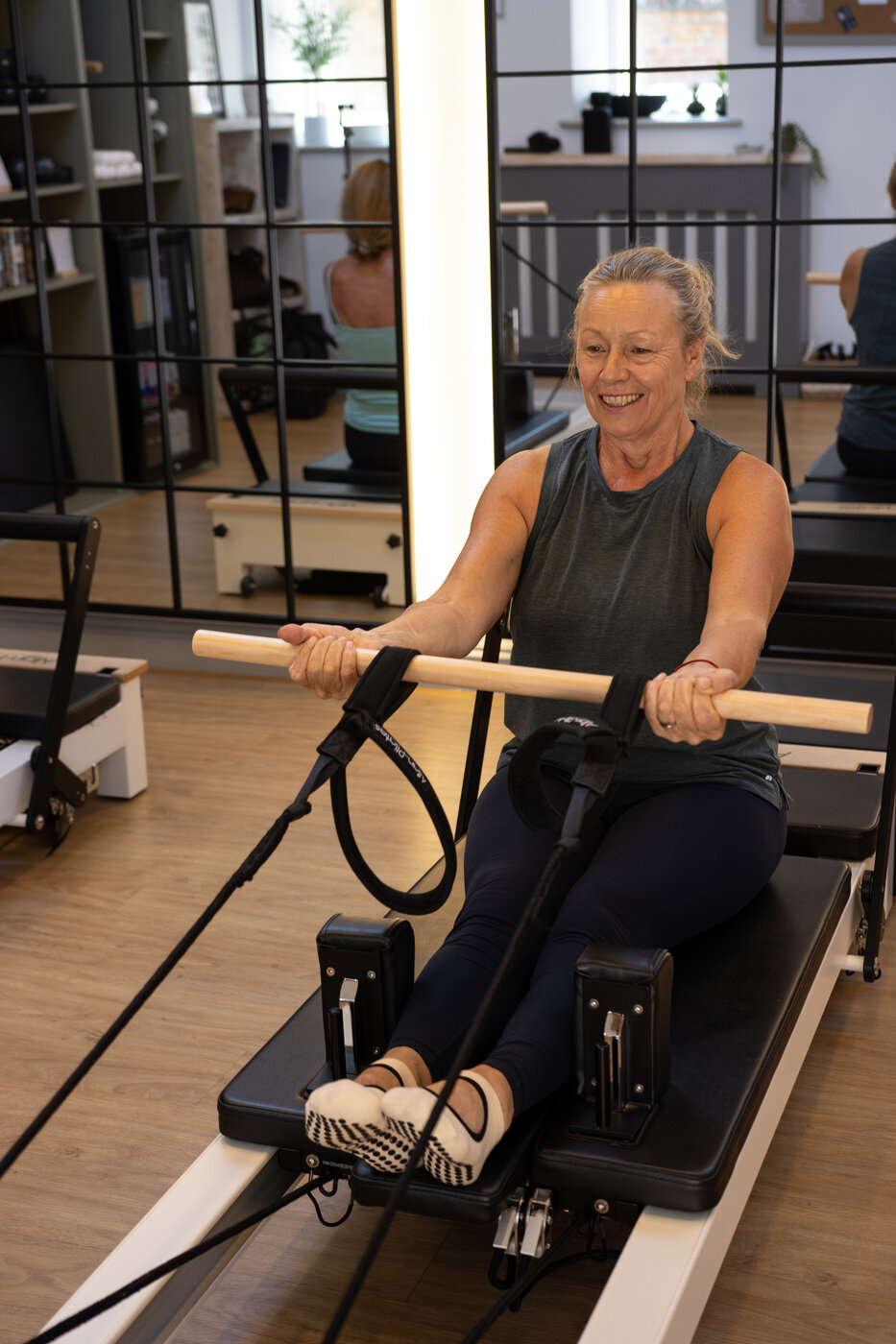 A client smiling mid-session at EVOLVE